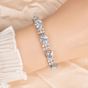 Wholesale Zircon Charm Bracelet featuring clear sparkling stones on platinum plated copper from JuneJewelry.com.